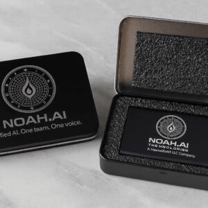 Black NOAH.AI branded metal boxes on table.